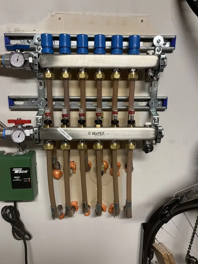 Plumber performing Water Heater Repair at a residential property in Hinsdale